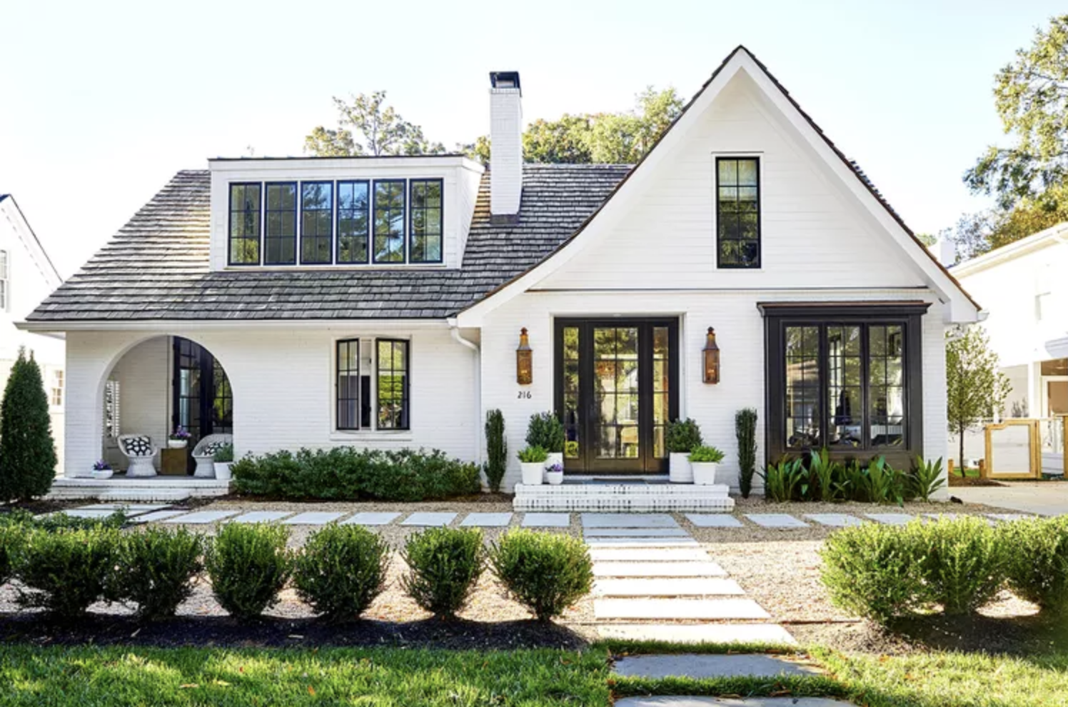 Elegant white acreage home representing your Lake Country listing